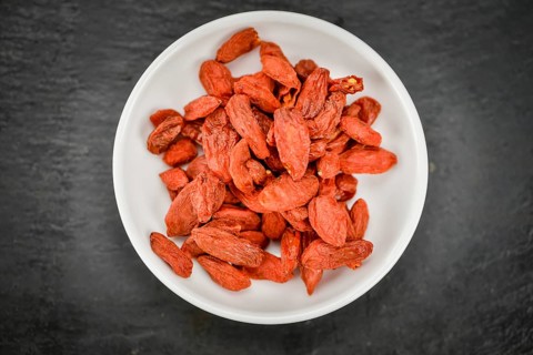 Goji Berries on a vintage background as detailed close-up shot (selective focus)
