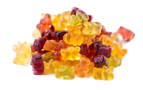Heap of Gummy Bears (close-up shot) isolated on white background