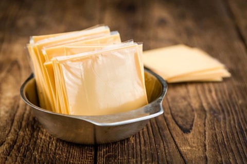 Portion of sliced Cheese (close-up shot, selective focus)