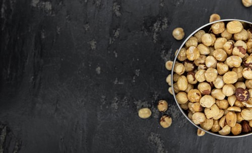Peeled Hazelnuts as detailed close up shot (selective focus)