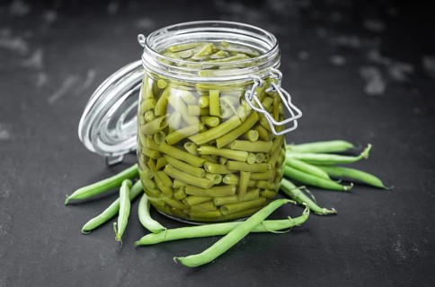 Portion of canned Green Beans (close-up shot, selective focus)