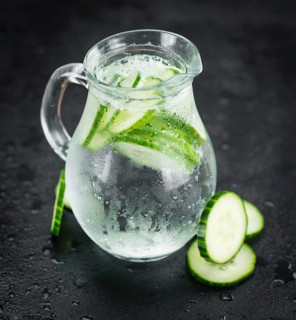 Some fresh Cucumber Water on a vintage slate slab, selective focus, close-up shot