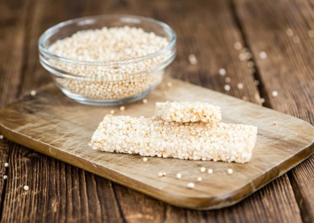 Some fresh made Quinoa Bars on vintage background (close-up shot)