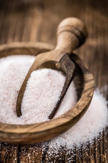 Pink Salt on a vintage background as detailed close-up shot (selective focus)