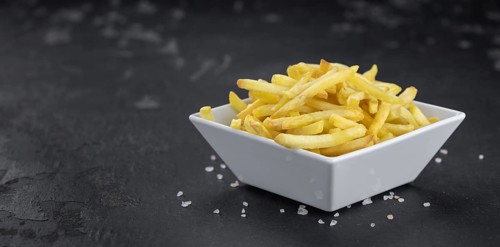 Portion of fresh made crispy French Fries (selective focus, close-up shot)