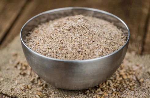 Portion of Wheat Bran as detailed close-up shot, selective focus