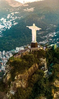 Cristo Redentor statue in Rio de Janeiro (aerial shot made from a helicopter) during a spectacular