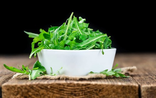 Portion of fresh Arugula (detailed close-up shot, selective focus)