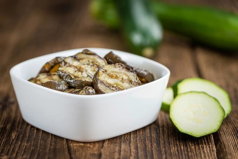 Homemade Antipasti (Grilled Zucchinis) on vintage background (selective focus, close-up shot)