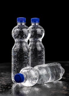 Bottles of chilled sparkling water as detailed close up shot