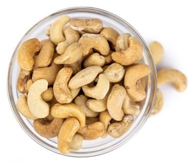 Cashew Nuts isolated on white background (close up shot, selective focus)
