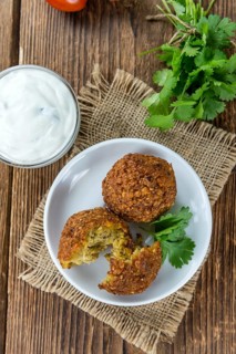 Homemade Falafel (close-up shot, selective focus) on wooden background