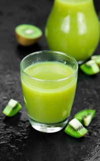 Kiwi Smoothie (selective focus) on an old and vintage background (homemade)
