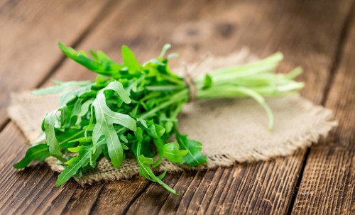 Portion of fresh Arugula (detailed close-up shot, selective focus)