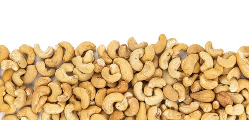 Cashew Nuts isolated on white background (close up shot, selective focus)