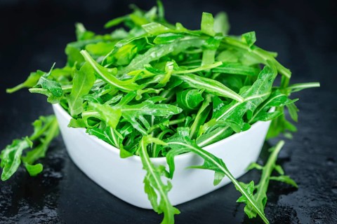 Portion of fresh Arugula (detailed close-up shot, selective focus)
