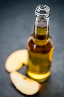 Apple Cider on a vintage background as detailed close-up shot (selective focus)