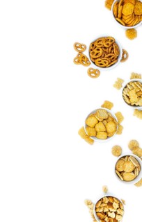 Portion of mixed Snacks isolated on white background (close up shot, selective focus)