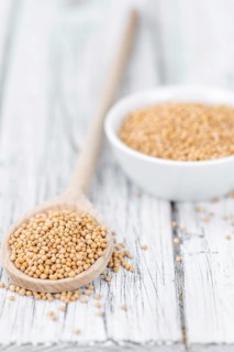Portion of fresh made Mustard Seeds (close-up shot, selective focus)