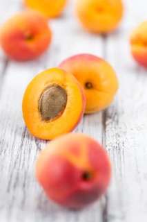 Apricots on a vintage background as detailed close-up shot (selective focus)