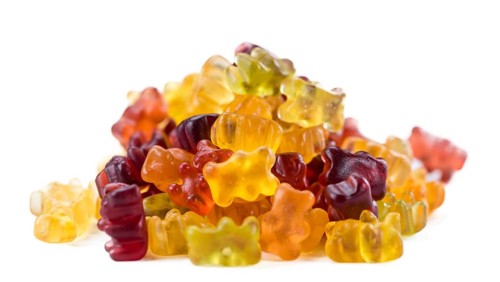 Heap of Gummy Bears (close-up shot) isolated on white background
