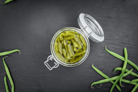 Portion of preserved Green Beans as detailed close-up shot (selective focus)