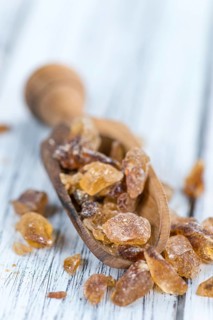 Portion of brown Rock Candy as detailed close-up shot (selective focus)