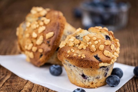 Some fresh Blueberry Muffins (selective focus, close-up shot)