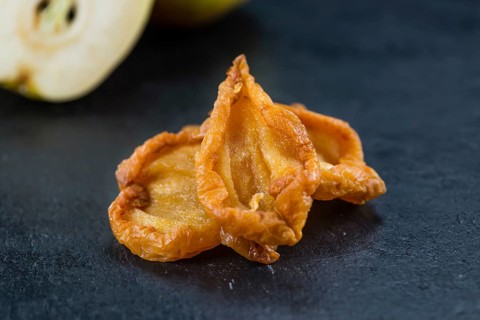 Slate slab with dried Pears (close-up shot, selective focus)