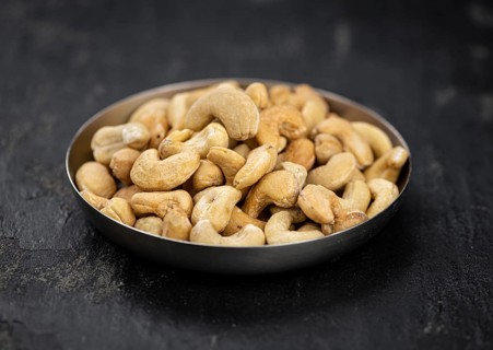 Portion of Cashew Nuts (close up shot, selective focus)