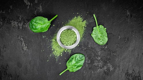 Freshly made green spinach powder (detailed close up shot, selective focus)