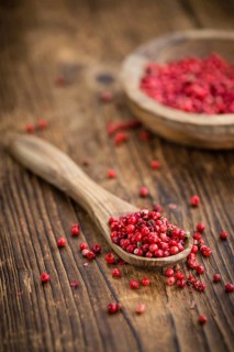 Portion of fresh Pink Peppercorns close-up shot, selective focus