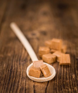 Portion of fresh Caramel (close-up shot, selective focus)