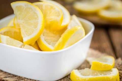Lemon Slices on a vintage background as detailed close-up shot (selective focus)