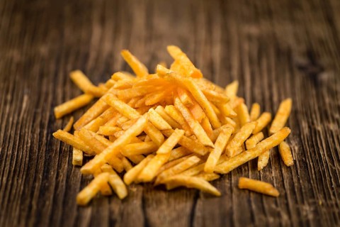 Portion of fried potato sticks (close-up shot, selective focus)