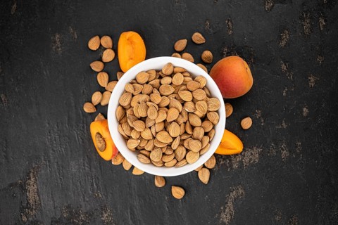 Some shelled Apricot Kernels as detailed close up shot (selective focus)
