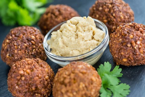 Wooden table with Falafels (close-up shot, selective focus)
