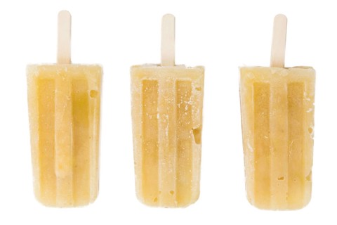 Fresh made Apple Popsicles (close-up shot) isolated on white background