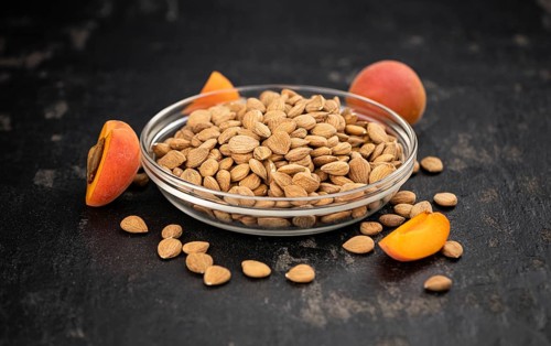 Some shelled Apricot Kernels as detailed close up shot (selective focus)