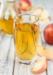 Apple Cider on a vintage background as detailed close-up shot (selective focus)