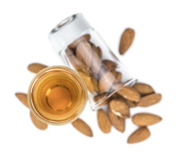 Amaretto as detailed close-up shot isolated on white background (selective focus)