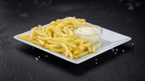 Portion of fresh made French Fries (close-up shot, selective focus)