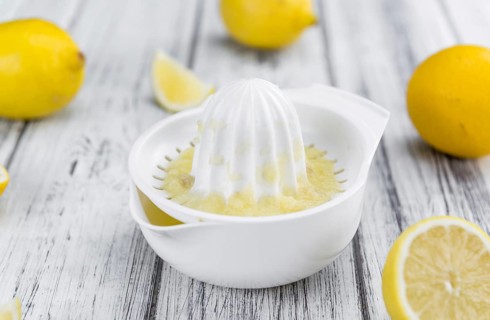 Fresh made Juice (lemon) on a vintage background (close-up shot)