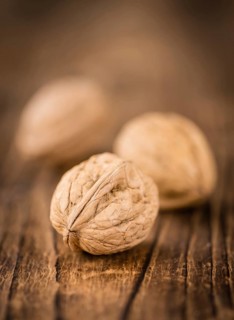Portion of fresh Walnuts (close-up shot, selective focus)