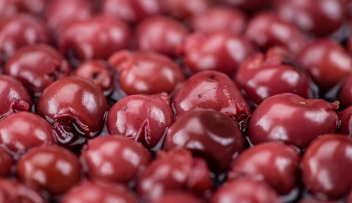 Preserved Cherries on a vintage background as detailed close-up shot, selective focus