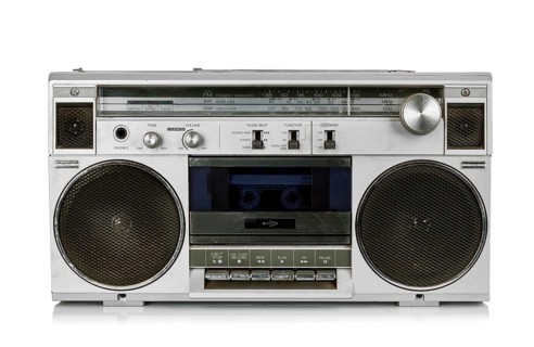 Portable vintage radio cassette recorder isolated on white