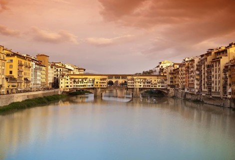Far view at sunset of Ponte Vecchio in Florence, Italy, Europe