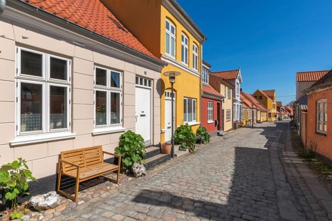 Old town of Rudkobing, renovated houses, colourful row of houses, dormers, lantern, decorative