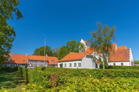 Lindelse Kirke, typical Danish church from 1830, whitewashed, red tiled roof, hill, pastorate,