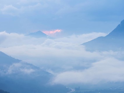 Evening clouds and fog over the Liesingtal, in the valley the village of Traboch, Schoberpass